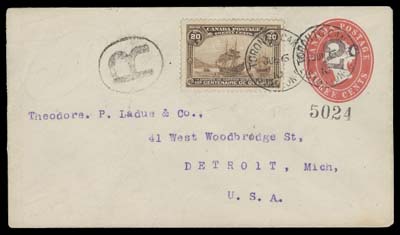 CANADA  1910 (June 6) 2c on 3c Red postal envelope (full-size 140 x 80mm) uprated with a well centered 20c Québec Tercentenary and nicely tied by Toronto Station C postmarks, oval "R" registration handstamp at left to Detroit with double circle JUN 7 1910 receiver backstamp; philatelic franking but still an elusive usage of this high value, VF (Unitrade 103, EN18)