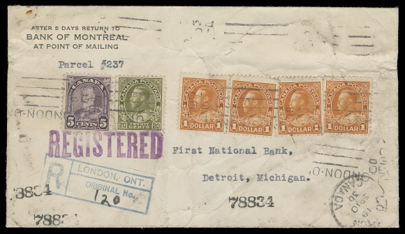 CANADA  1930 (September 10) Bank of Montreal money packet paste-on envelope franked with four examples of $1 orange, plus single 20c olive green and 5c violet Arch tied by London, ON dated roller for total $4.25 registered rate to Detroit, dispatch CDS at lower right; overall typical wrinkling as expected for such heavy parcel post usage, Fine (Unitrade 119, 122, 170)