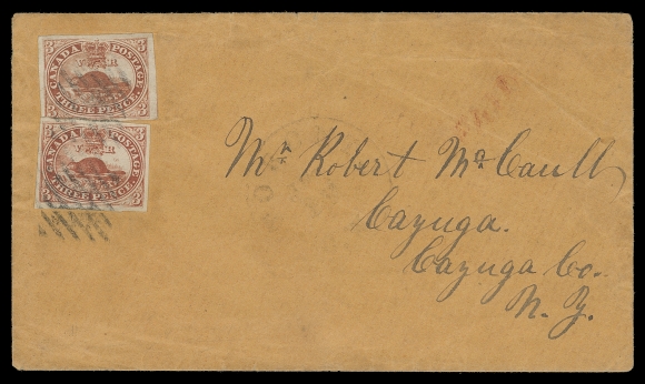 CANADA  Orange cover bearing two slightly overlapping large margined imperforate 3p red on medium wove paper, tied by diamond grid cancels of Toronto, partially legible large Toronto JUL 17 circular datestamp (circa. 1858) light italic PAID handstamp in red, addressed to Cayuga, New York; portion of backflap missing and light wrinkling. An attractive 6 pence rate to the US, F-VF cover with VF-XF stamps (Unitrade 4)
