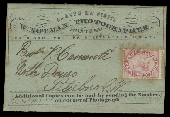HALF PENNY AND ONE CENT Undated W. Notman Photographer, Montreal, bluish green card stock advertising wrapper (originally containing photographs) mailed from Montreal to Peterboro, C.W. bearing single 1c rose, perf 12, minor toning mainly surrounding perfs, tied by light grid; paying one cent printed matter rate, very attractive, VF (Unitrade 14) ex. Fred Goodhelpsen collection (private sale late 1970s)