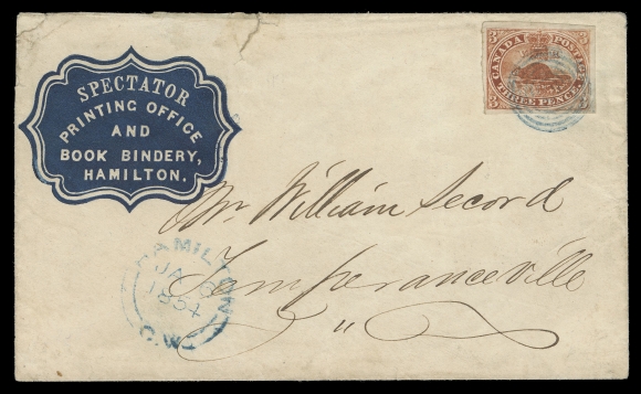 THREE PENCE AND FIVE CENTS  1854 (January 6) Dark Blue cameo "Spectator Printing Office and Book Bindery Hamilton" embossed advertising envelope, bearing a large margined 3p brown red on medium wove paper tied by concentric rings and clear Hamilton double arc dispatch datestamp both struck IN BLUE; couple small opening tears at top. A wonderful cover with great eye-appeal, VF (Unitrade 4a)Provenance: Sam Nickle Collection, Christie
