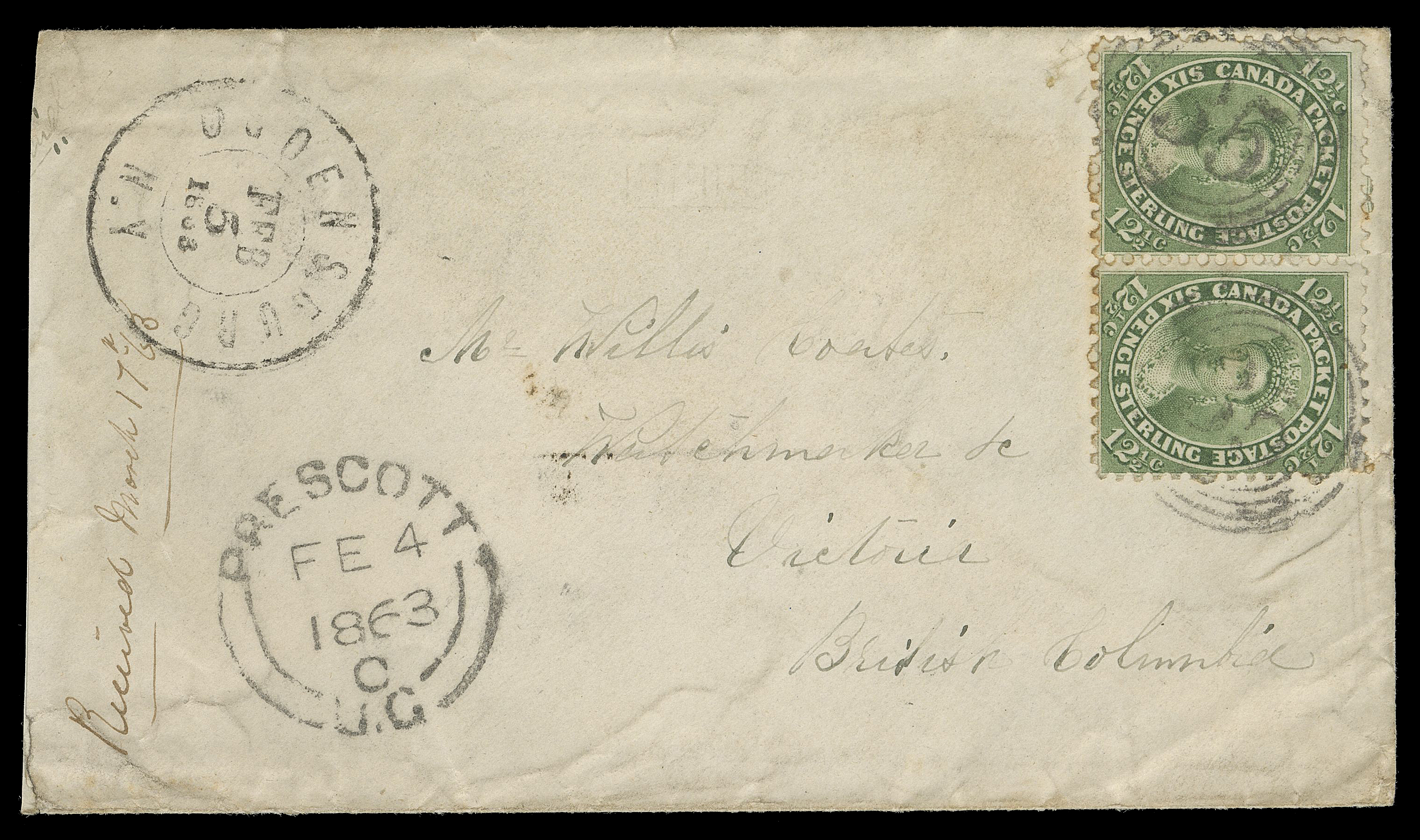 SEVEN AND ONE HALF PENCE AND TWELVE AND ONE HALF CENTS  1863 (February 4) Cover from Prescott, U.C. to Victoria, Colony  of Vancouver Island, bearing a horizontal pair of 12½c olive  green, perf 11¾, nicely centered, light crease along perfs of  right stamp, nicely tied by four-ring 